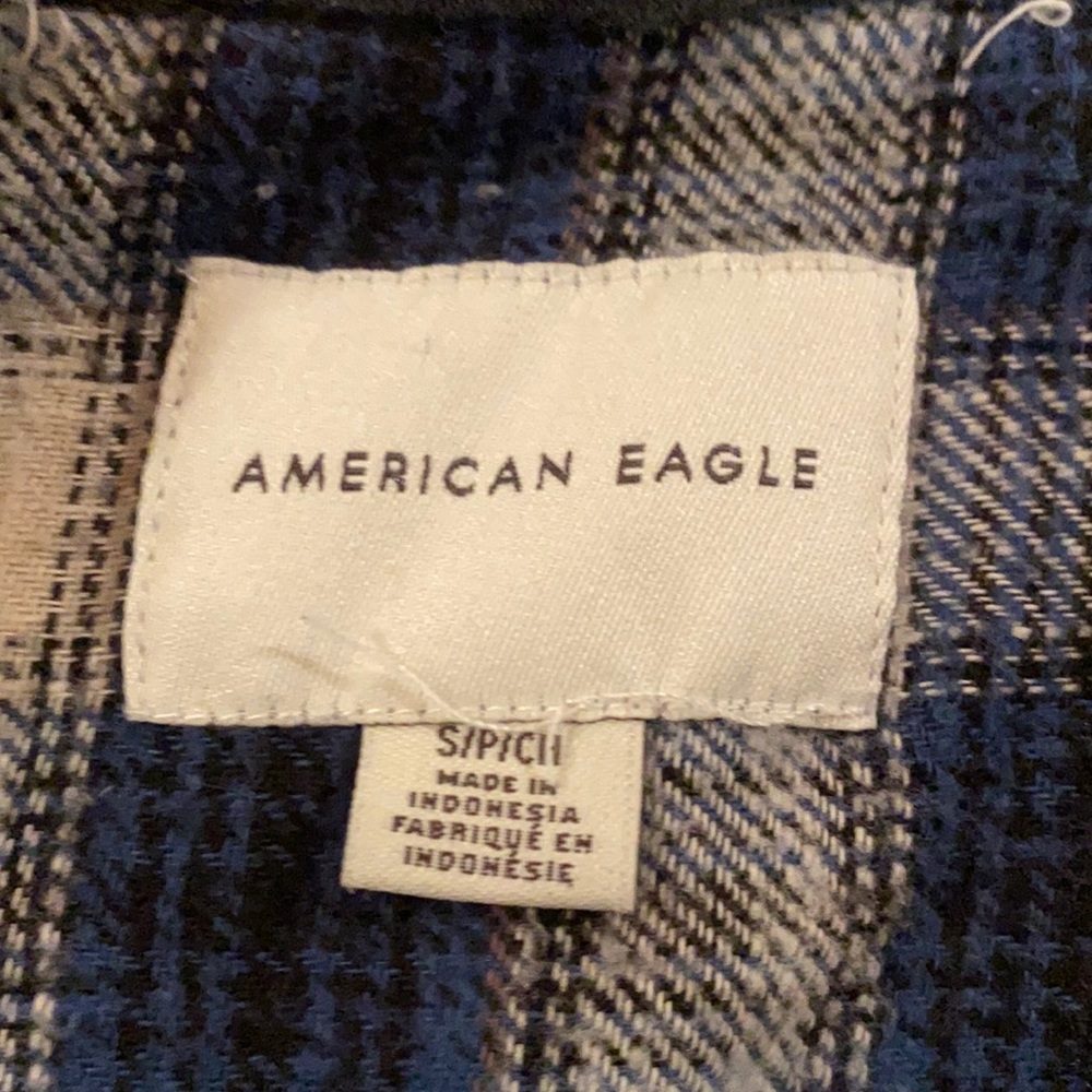 Flannel, with hood. Only worn once or twice. Nice material.